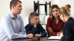child looking bored in a divorce meeting with lawyer