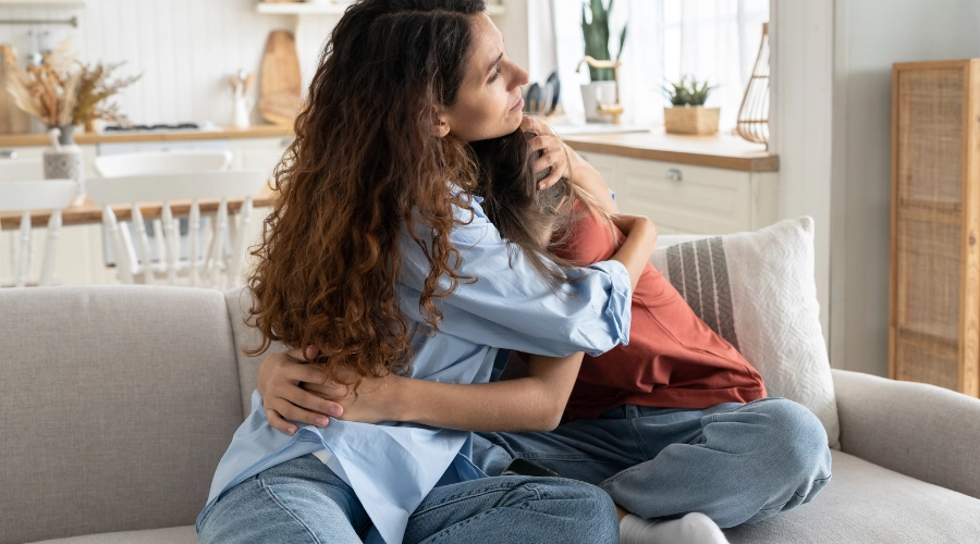 mother hugging child