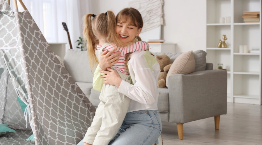 lady hugging a little girl