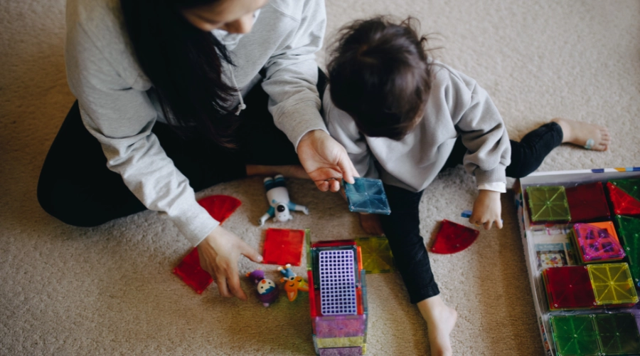 lady with child playing toys