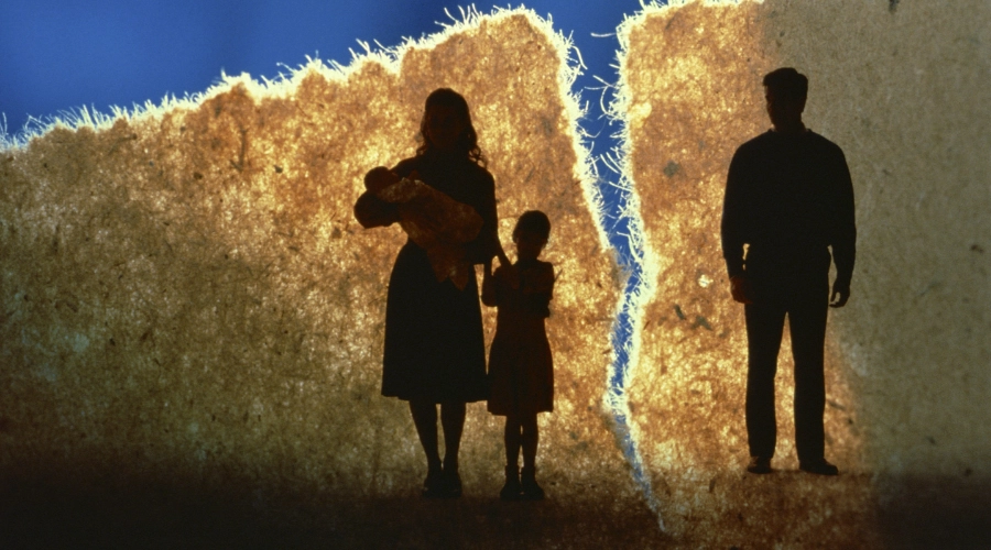 silhouette of family man separated by paper rip